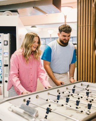 Students playing table football on the Lyon campus of INSEEC business school