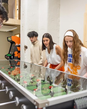 Students playing table football on the Rennes campus of the INSEEC business school